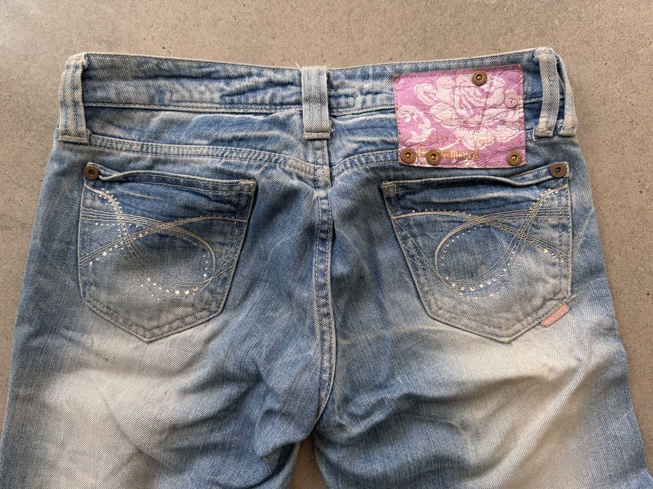 Spodnie z dziurami za kolano River Island rozm. 12