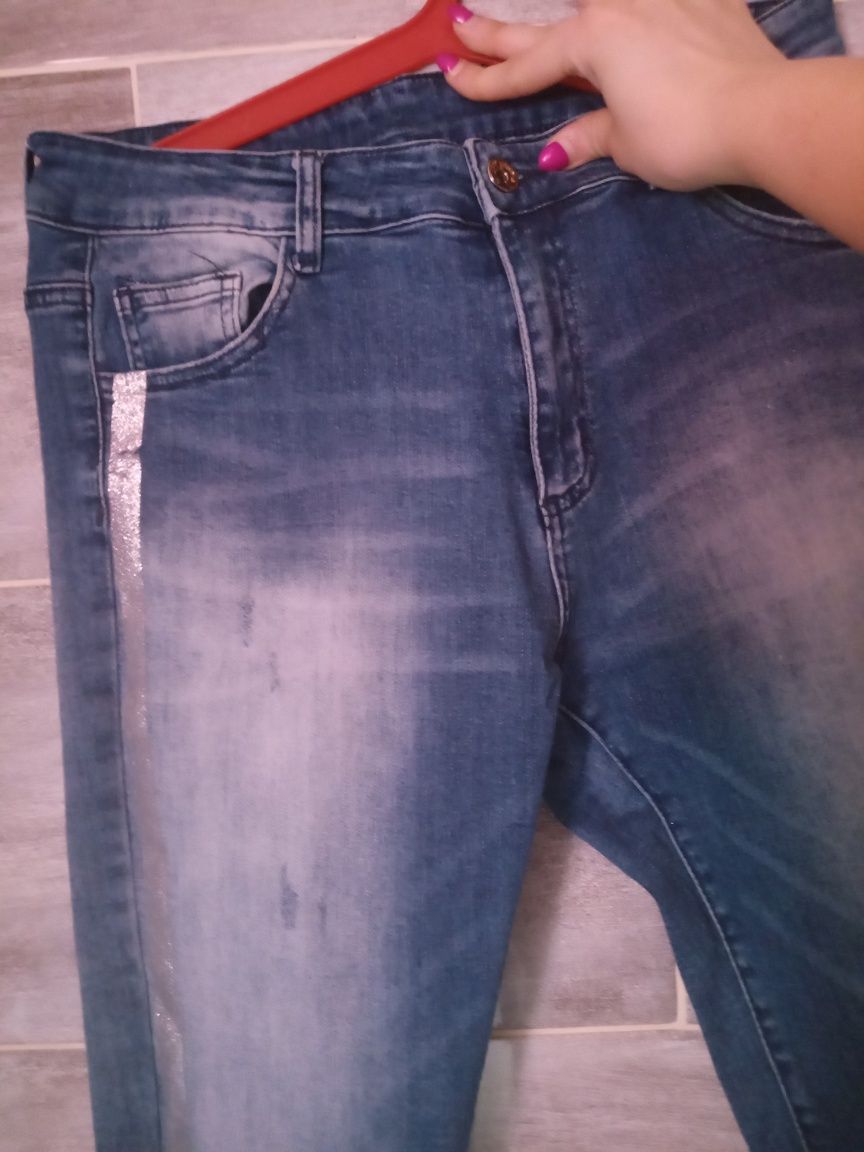 Spodnie jeansowe z błyszczącym lampasem rozmiar XL  dżinsowe spodnie
