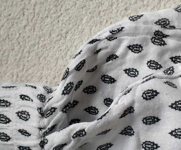 Biała spódnica mini, gumka w pasie, kieszenie, wzory