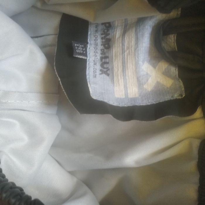 Kurtka i spodnie przeciwdeszczowe na wzrost 122/128 cm Pomp De Lux