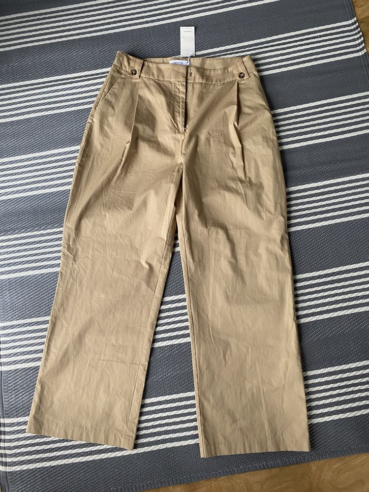 Jasne nowe spodnie dzwony modne spodnie xl
