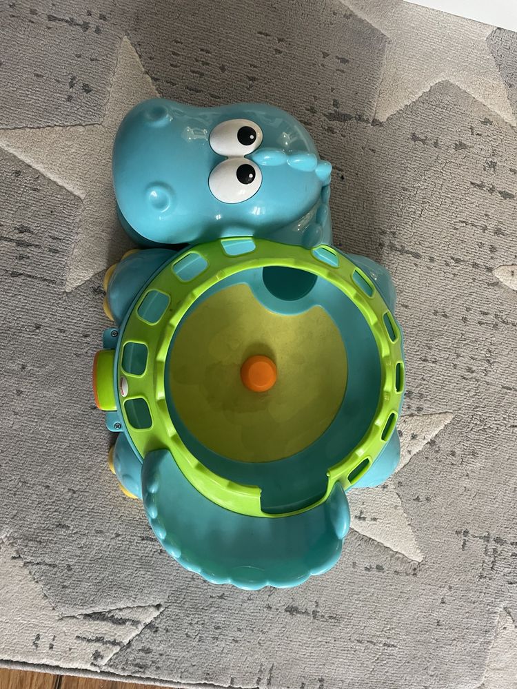 Fisher Price Muzyczny dinozaur z piłeczkami