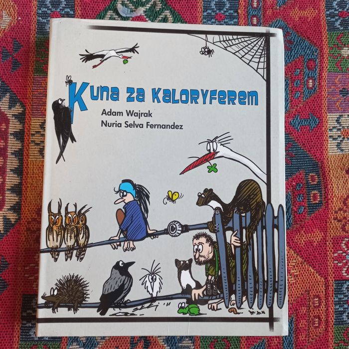 Kuna za kaloryferem Adam Wajrak