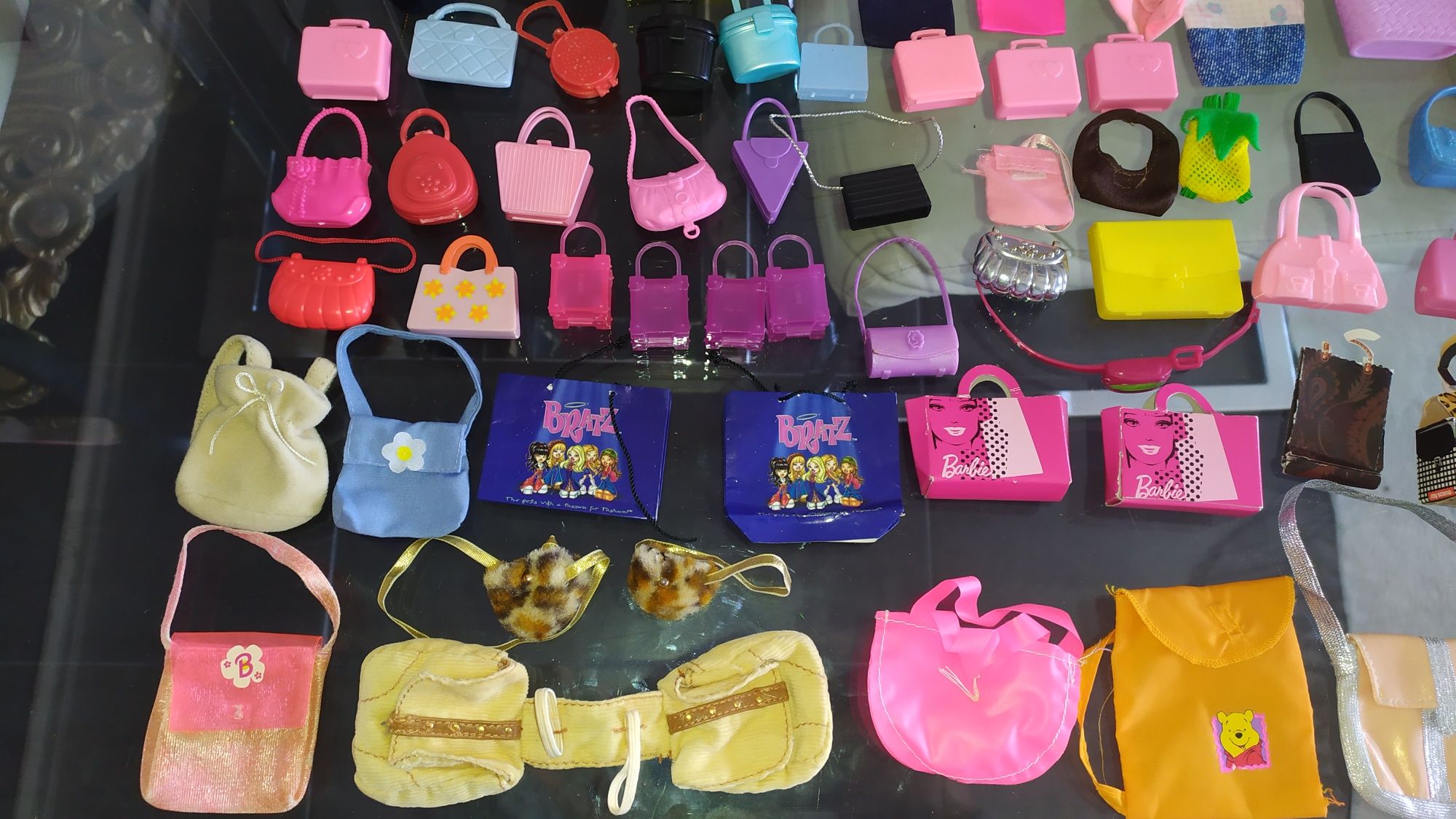 100 Malas, mochilas, bolsas, baús, carteiras barbie desde 1€ cada