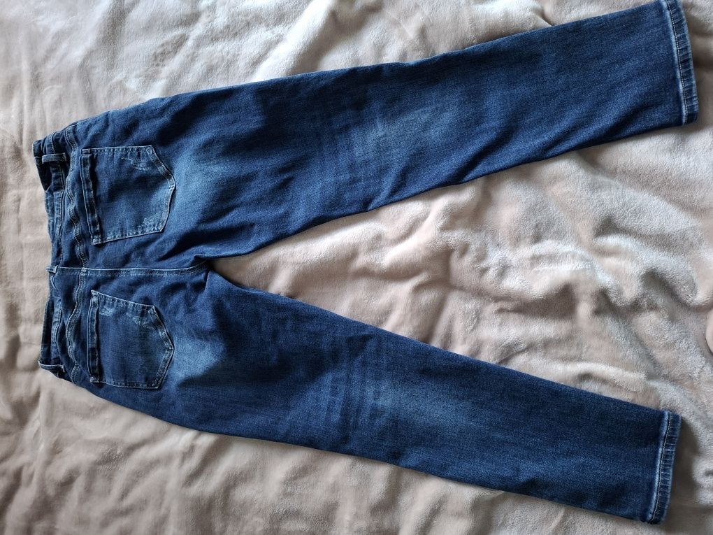 Jeansowe granatowe spodnie z podszytymi dziurami r.xl + gratis