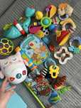 Zabawki interantywne motyl lamaze fisher price grzechotki książeczka