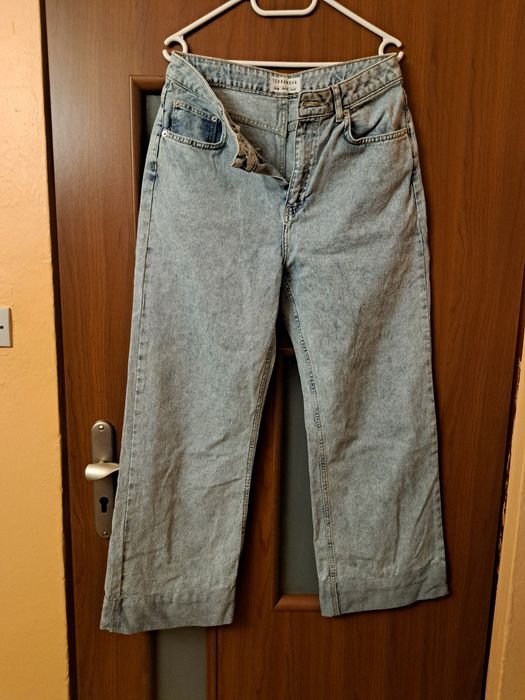 Damskie spodnie jeansowe jasne szerokie nogawki 42 XL