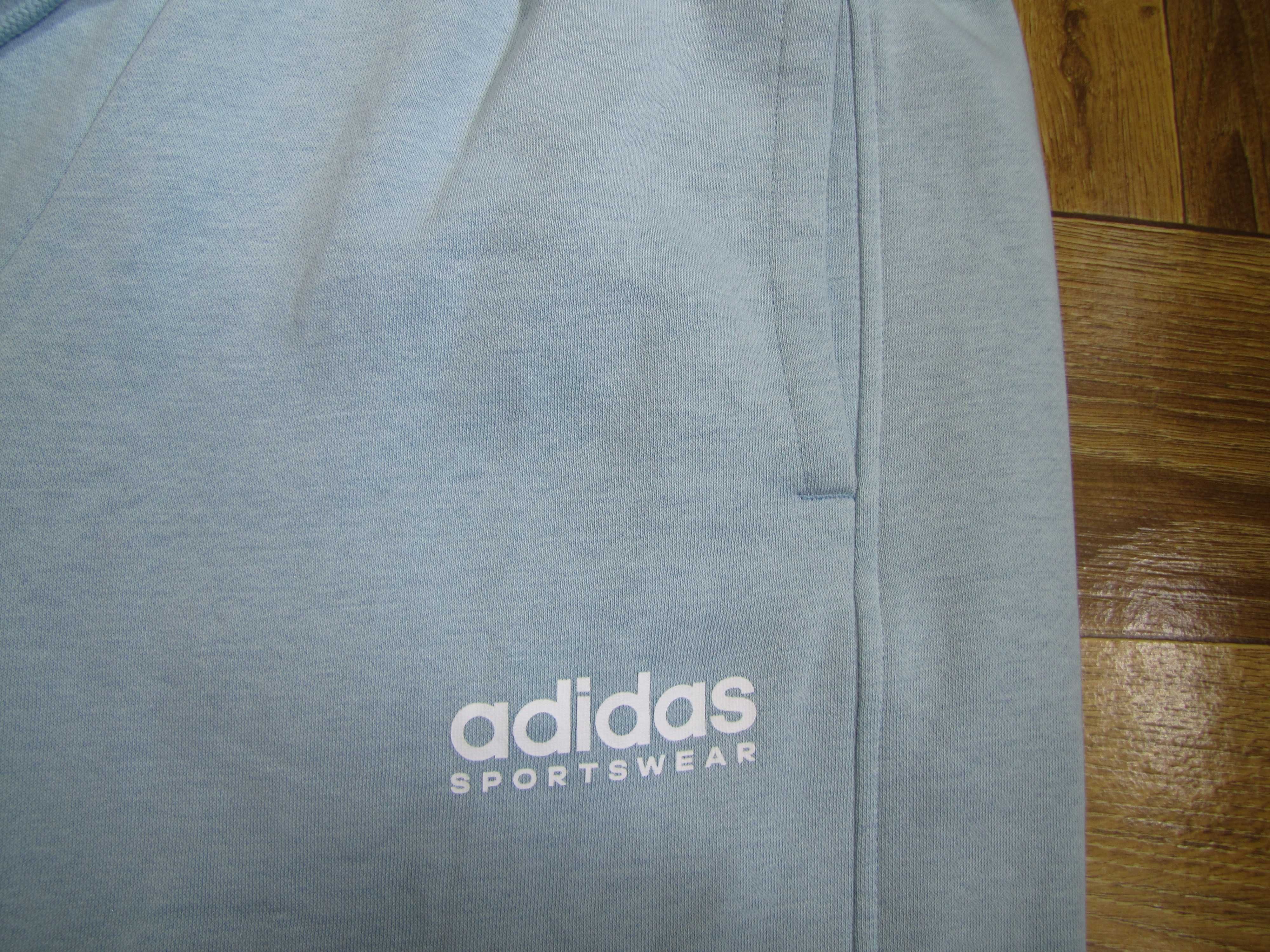 Damskie spodnie dresowe adidas All SZN Fleece Graphic