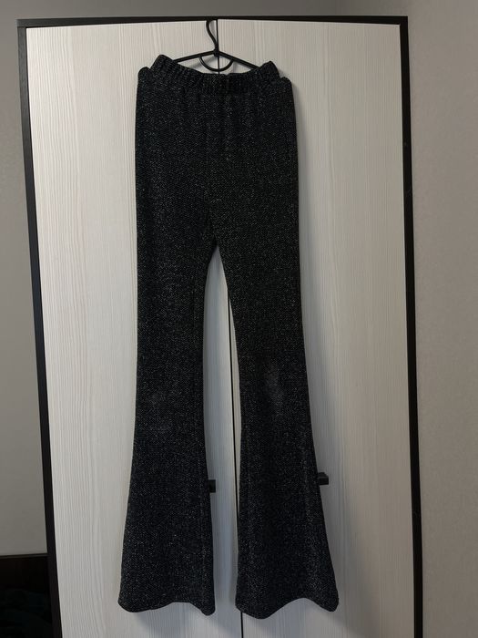 Блискучі штани кльош