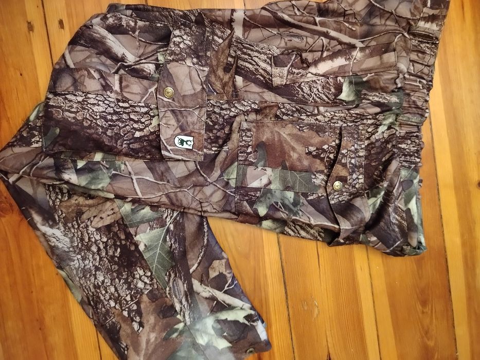 Deerhunter spodnie mysliwskie L khaki w moro z kieszeniami po boku

De
