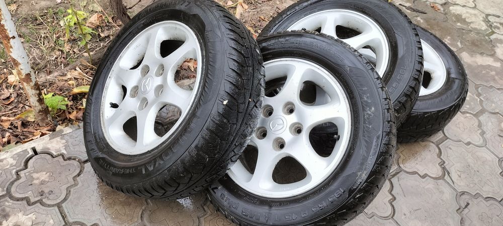 Продам, диски разом з шинами,на Мазда.