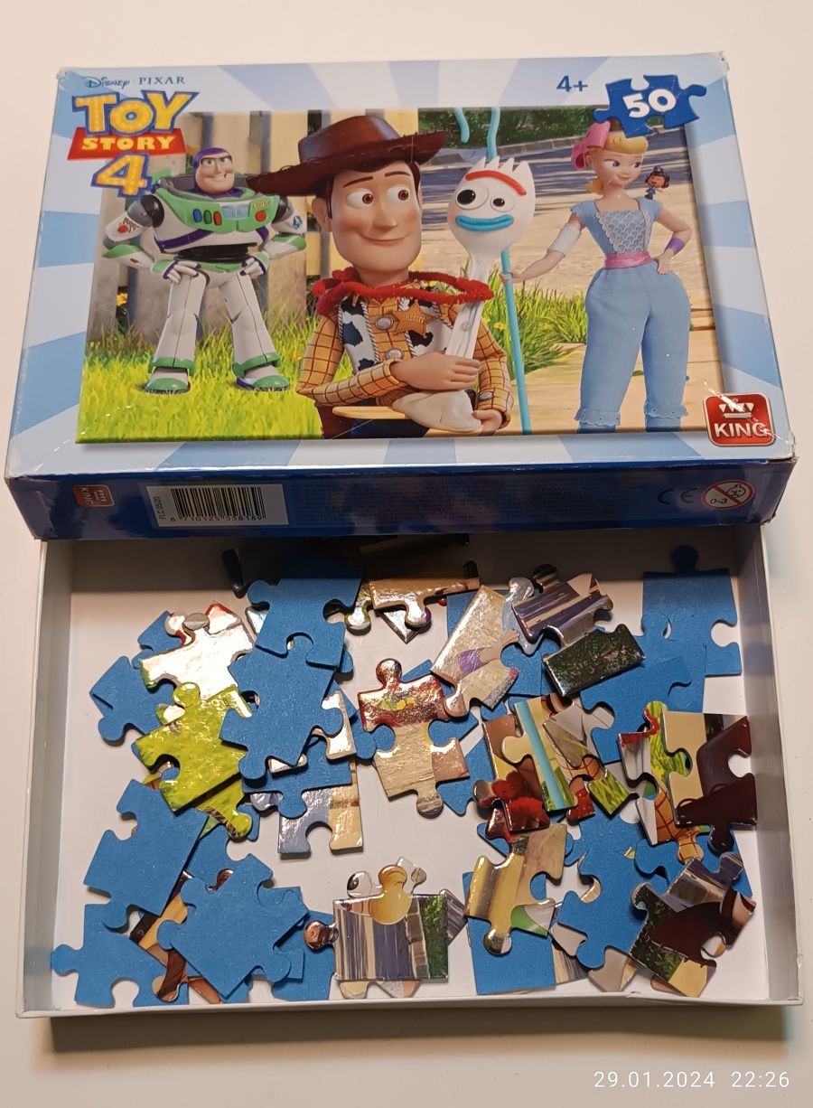 Zestaw puzzle + książka o dinozaurach z zagadkami