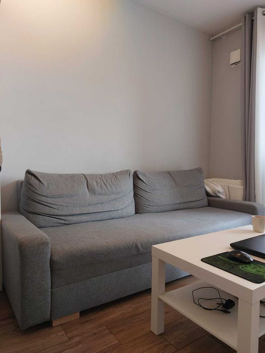 Używana kanapa z funkcją spania, dobrakondycja, z pojemnikiem. Sofabed