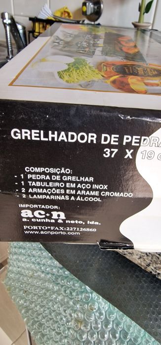 Grellador de pedra e lamparinas