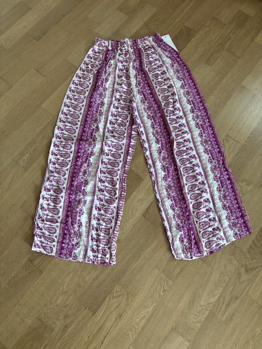 Pantalonas com padrão em tons de berigela