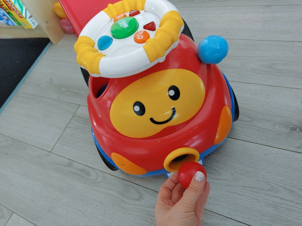 Jeździk auto smily z armatą na kołki strzela gra muzyka interaktywne