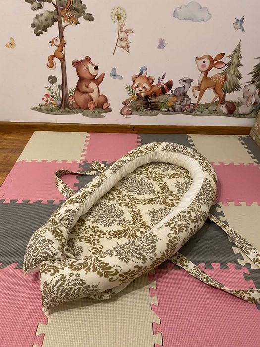 Łóżeczko–kokon dla niemowlęcia