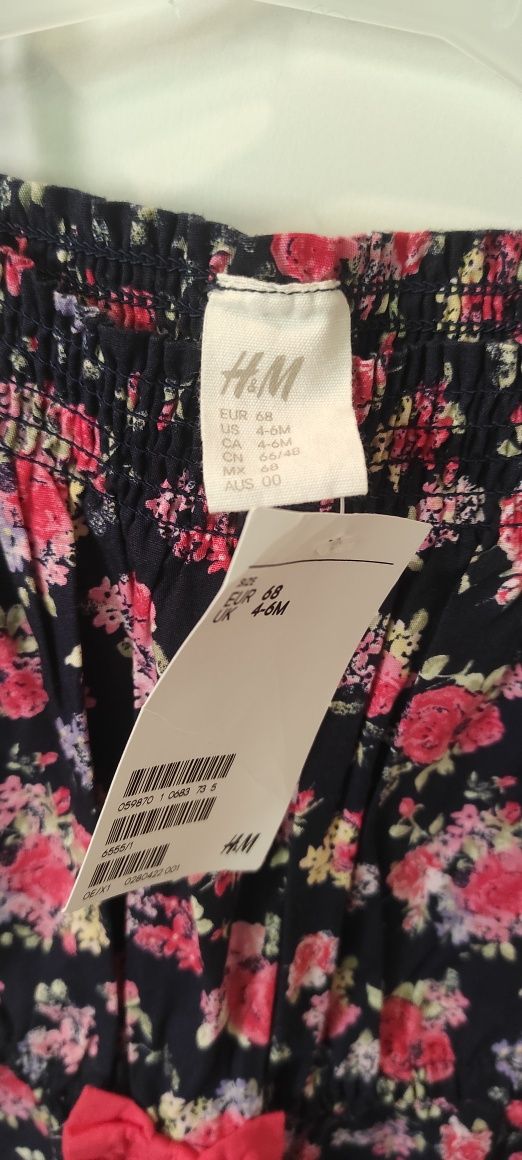 Kombinezon w różyczki. H&M rozmiar 68