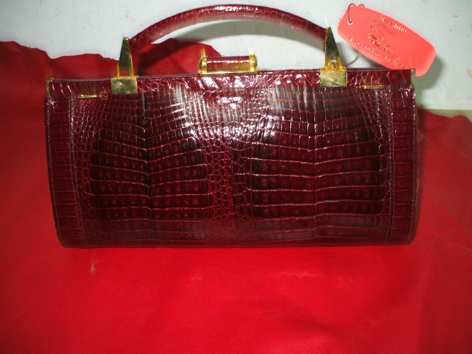 Mala em pele de crocodilo verdadeiro