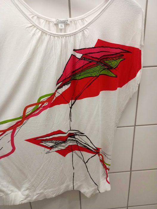 Śliczna biała bluzka, dzianina, aplikacja latawce. Solar