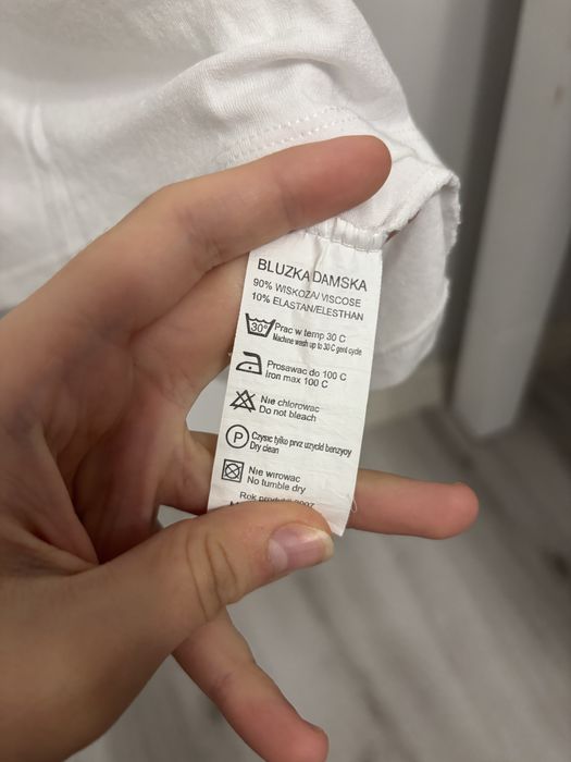 Biała bluzka sportowa polo