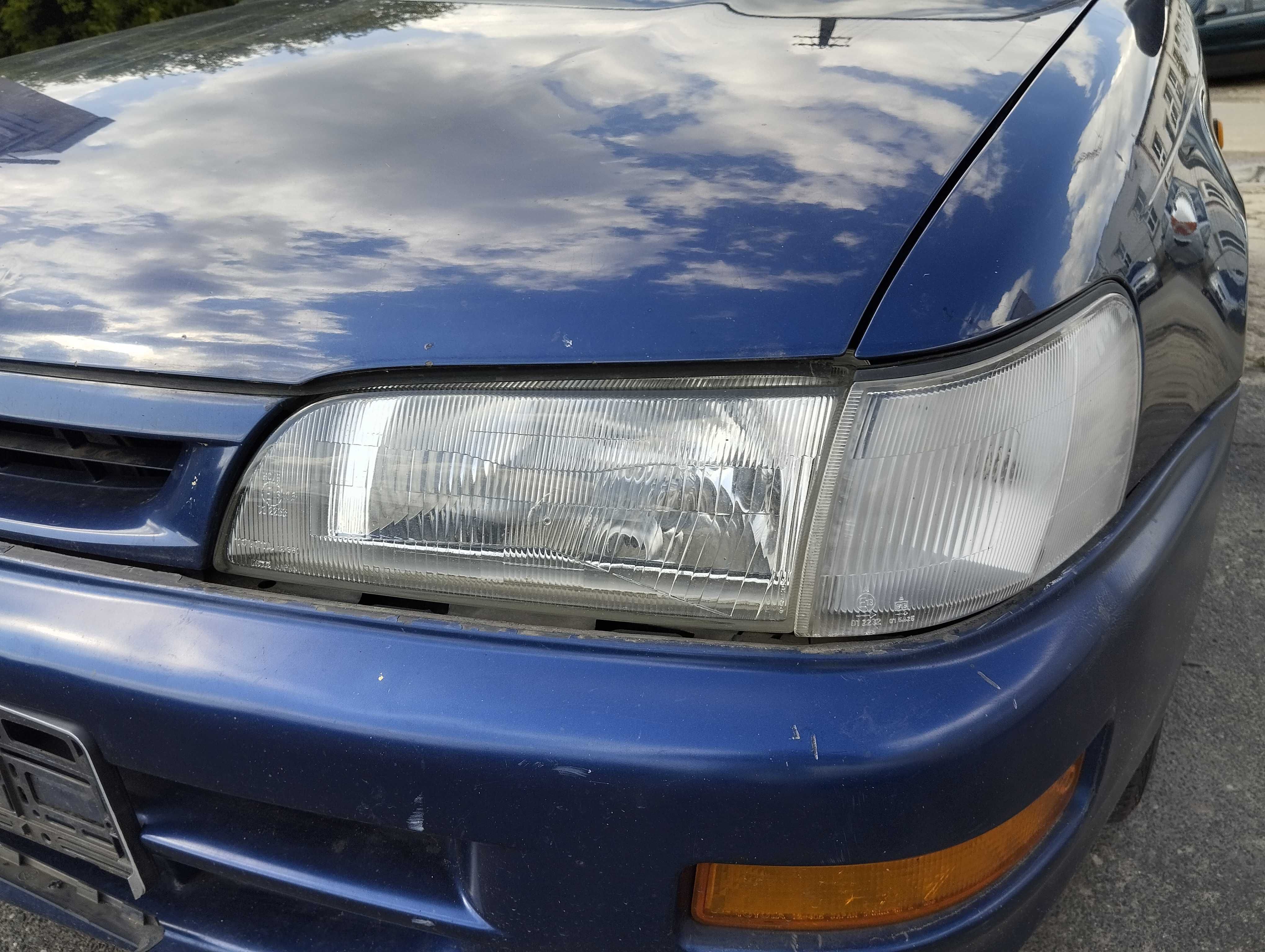 Toyota Corolla E10 3D 1,3i 1995r.Lampa przednia lewa.