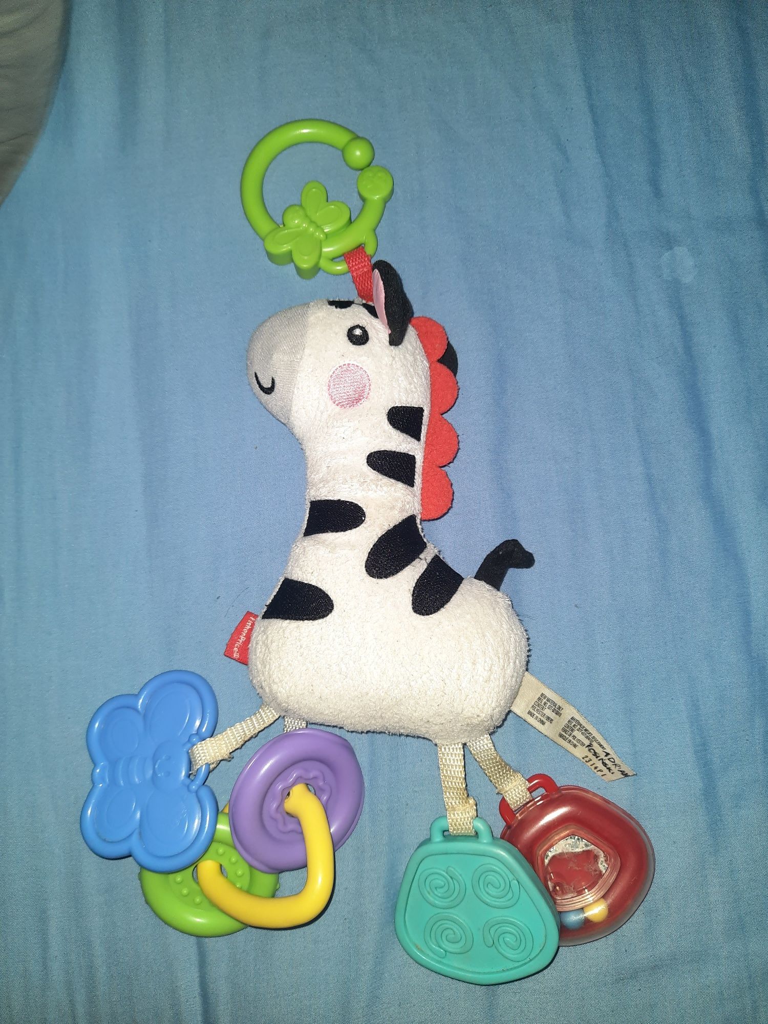 Fisher price zebra grzechotka.