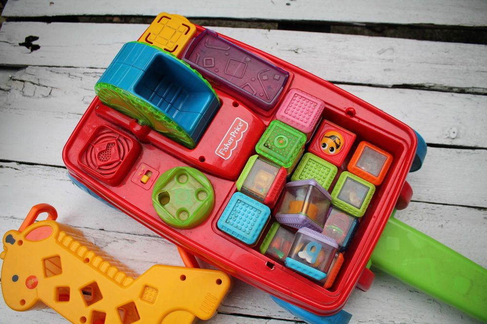 Fisher Price wózek klocki sensoryczne żyrafa zestaw