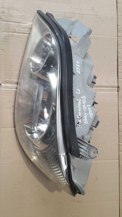 Farol esquerdo KIA CARNIVAL