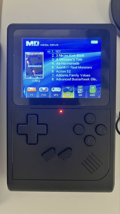 Нова портативна ігрова приставка з іграми денді сега та інші