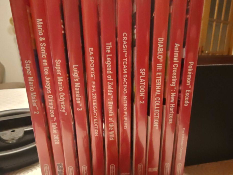 Nintendo Switch Consola + Caixa + Bolsa + Grip + Jogos