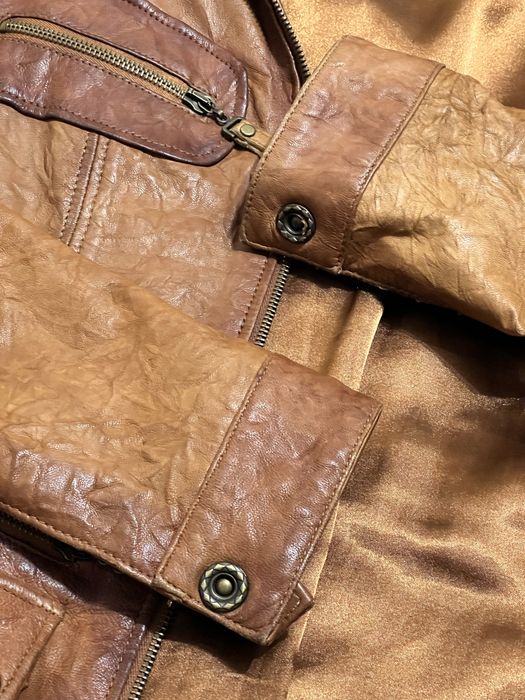 Жіноча куртка з натуральної шкіри ягняти