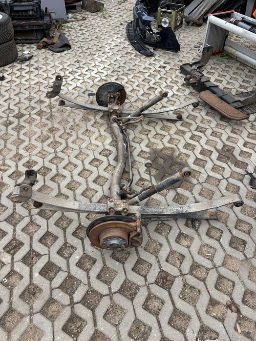VW Caddy oś belka tył podwójny resor przyczepka