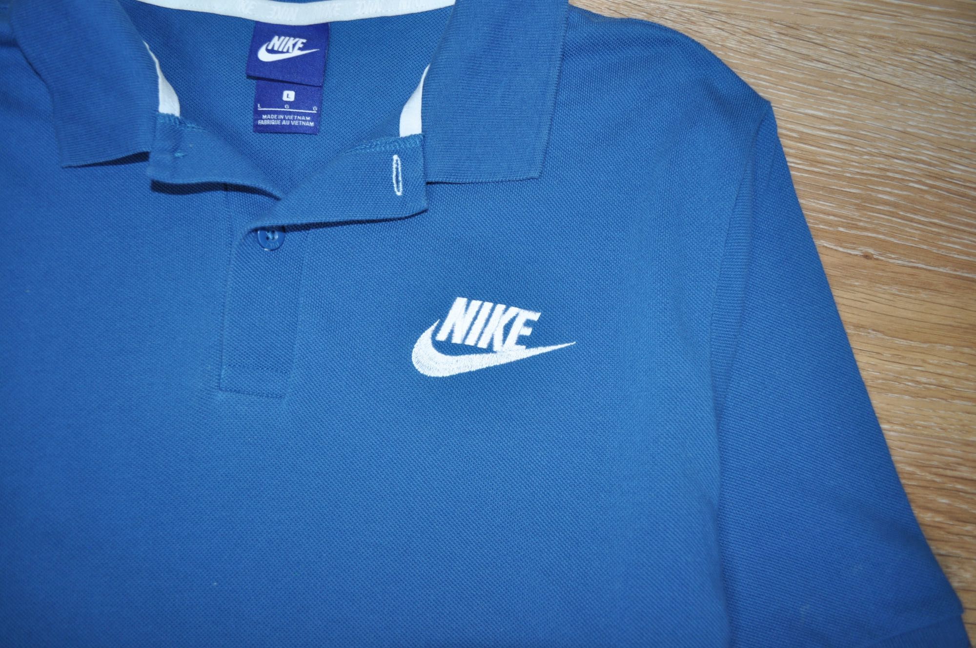 Синее трикотажное поло Nike