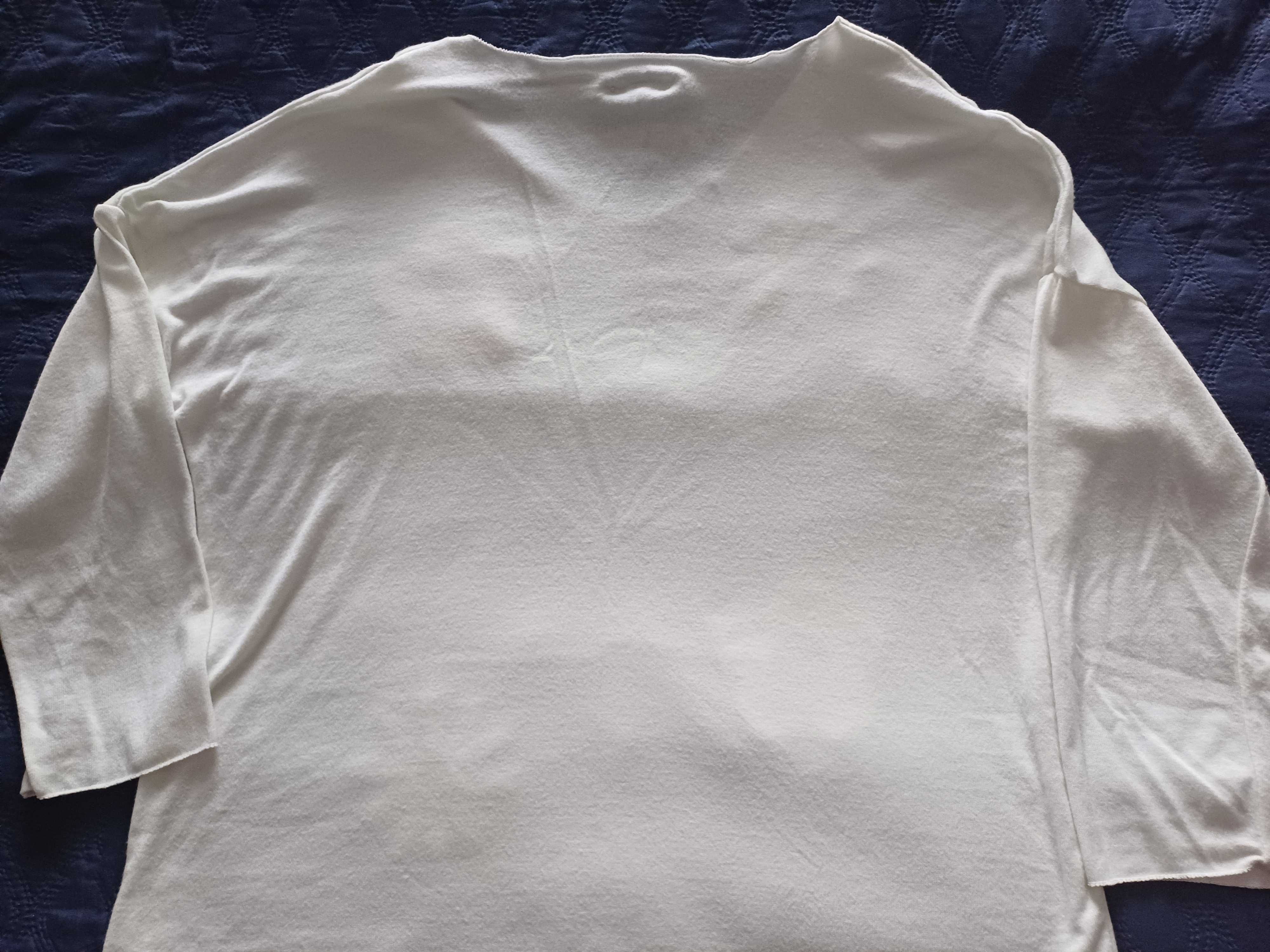 Sweter z aplikacjami.