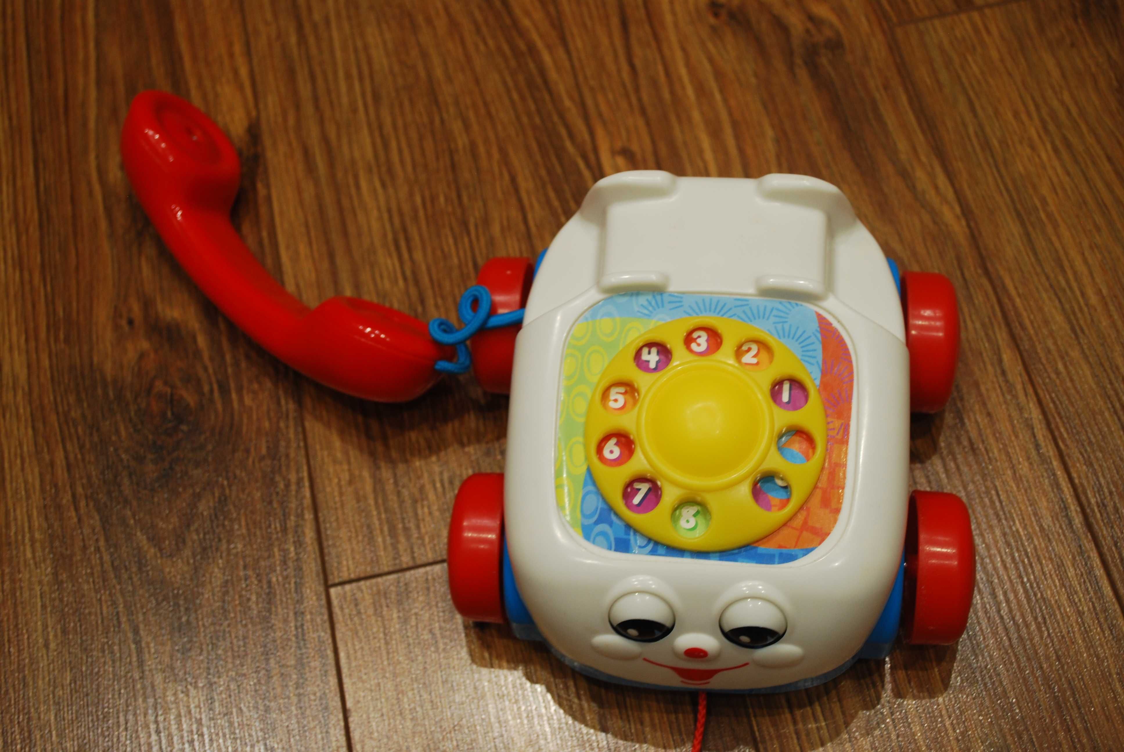 Fisher Price - jeżdżący telefon z oczkami