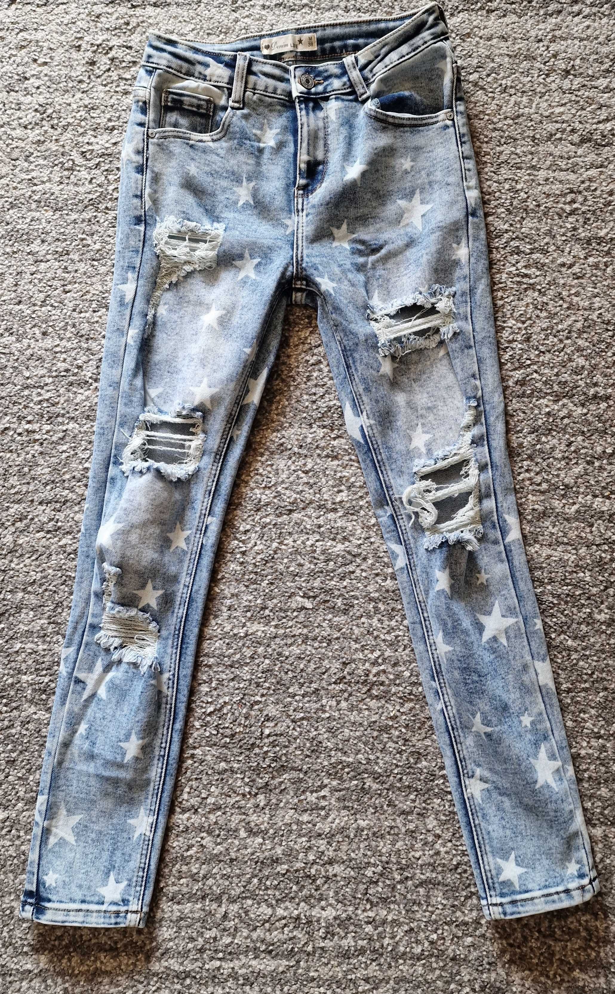 Nowe jeansy z rozdarciami butik Andzela r.M