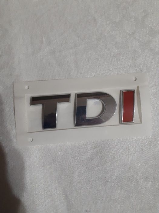 Эмблема  значок  шильдик  надпись  TDI  на  Volkswagen
