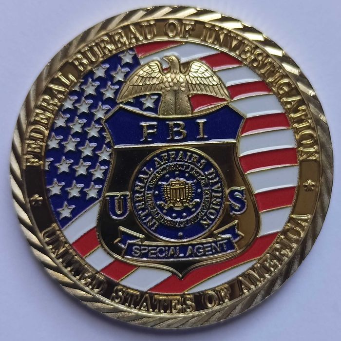 Okrągły medal przedstawiający odznakę agenta specjalnego FBI