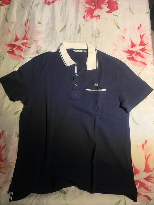 Camisa polo Lacoste azul com bolso
