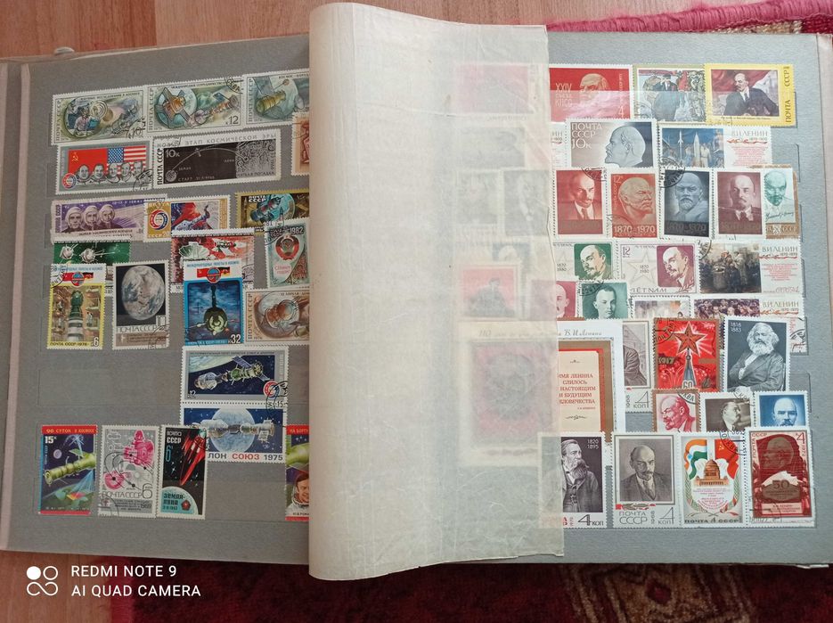 Марки почтовые в альбоме.