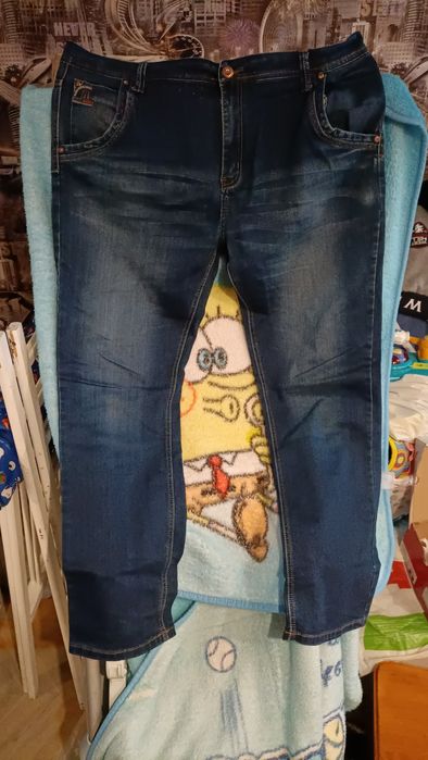 Продам мужские стрейчевые   джинсовые брюки .