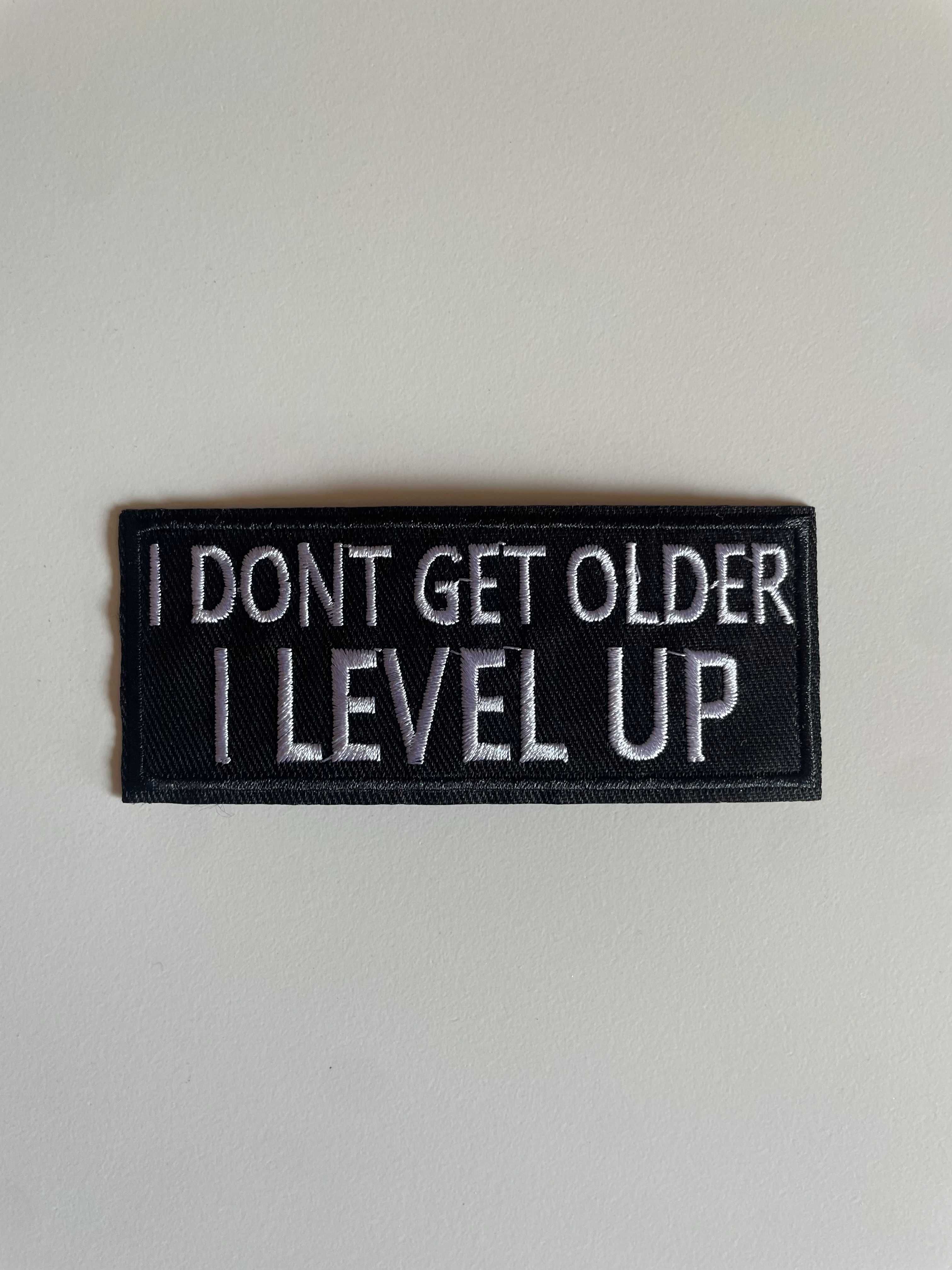 Emblema I Don't Get Older I Level Up