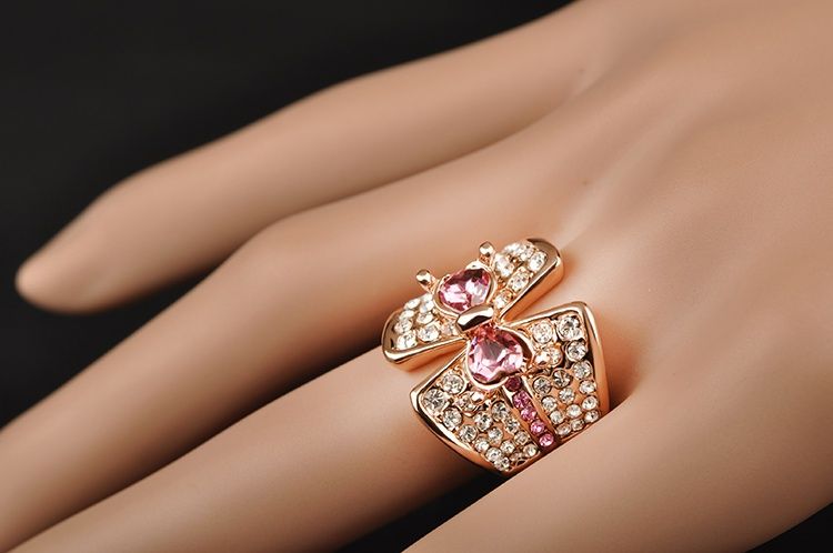 Кольцо, позолота розовым золотом, цирконы, "Бантик"