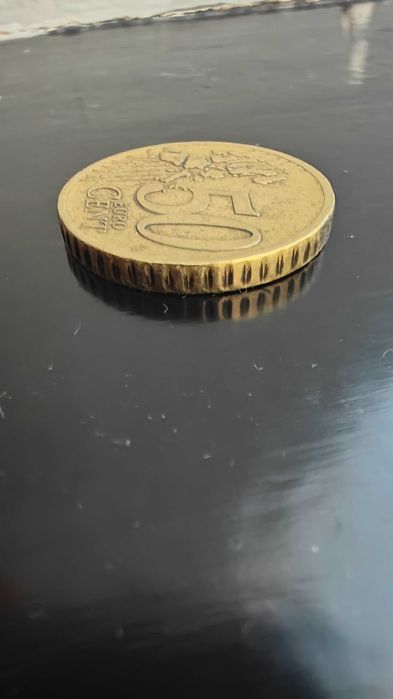 Moeda grega de 50c com F na estrela