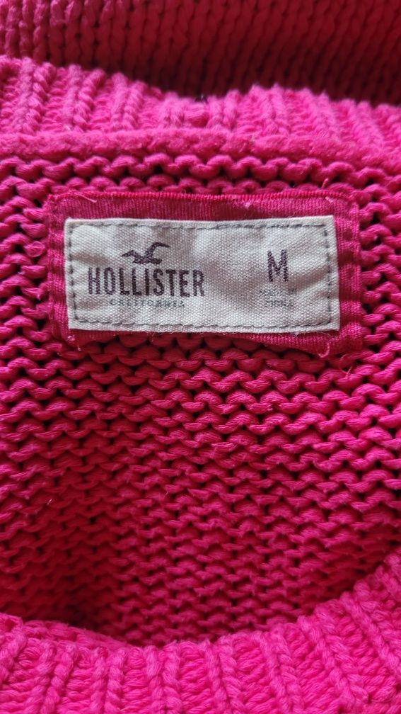Różowy sweter Hollister z eleganckim wiązaniem na plecach
