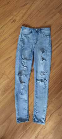 Spodnie z rozdarciami/dziurami niebieskie Divided H&M roz.36