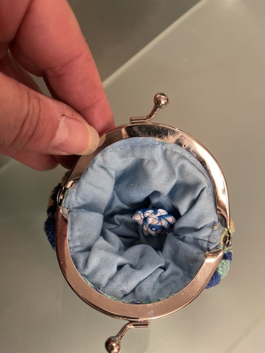 Porta moedas,crianca e senhora