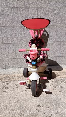 Triciclo evolutivo cor de rosa.