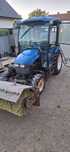 New holland tc27d z zamiatarką i plugiem do sniegu
